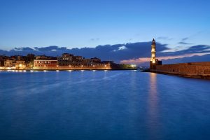 Lighthouse and port at night
